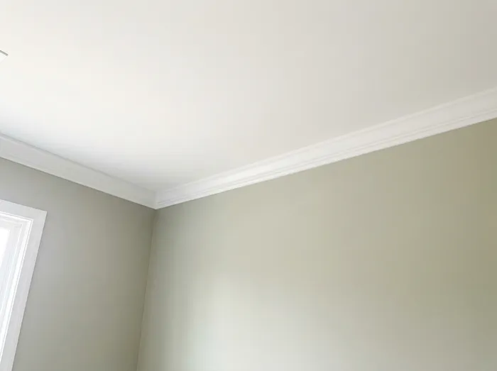Ceiling and wall meeting in a clean cut line after interior painting